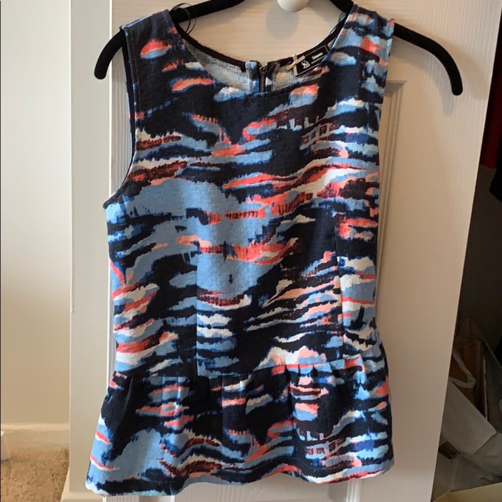 Structured peplum top from Paris designer boutique